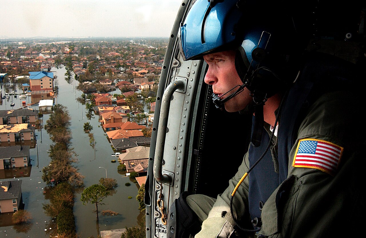 A U.S. coast guardsman searches for survivors in New Orleans in the Katrina aftermath.