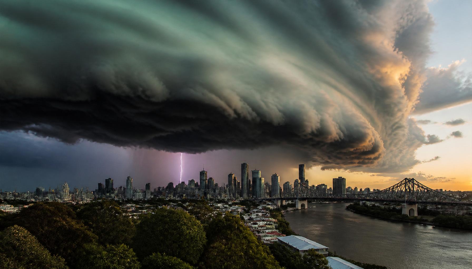 Dramatic supercell storm cloud over Brisbane city with lightning, similar to the 1985 Gap Hailstorm.