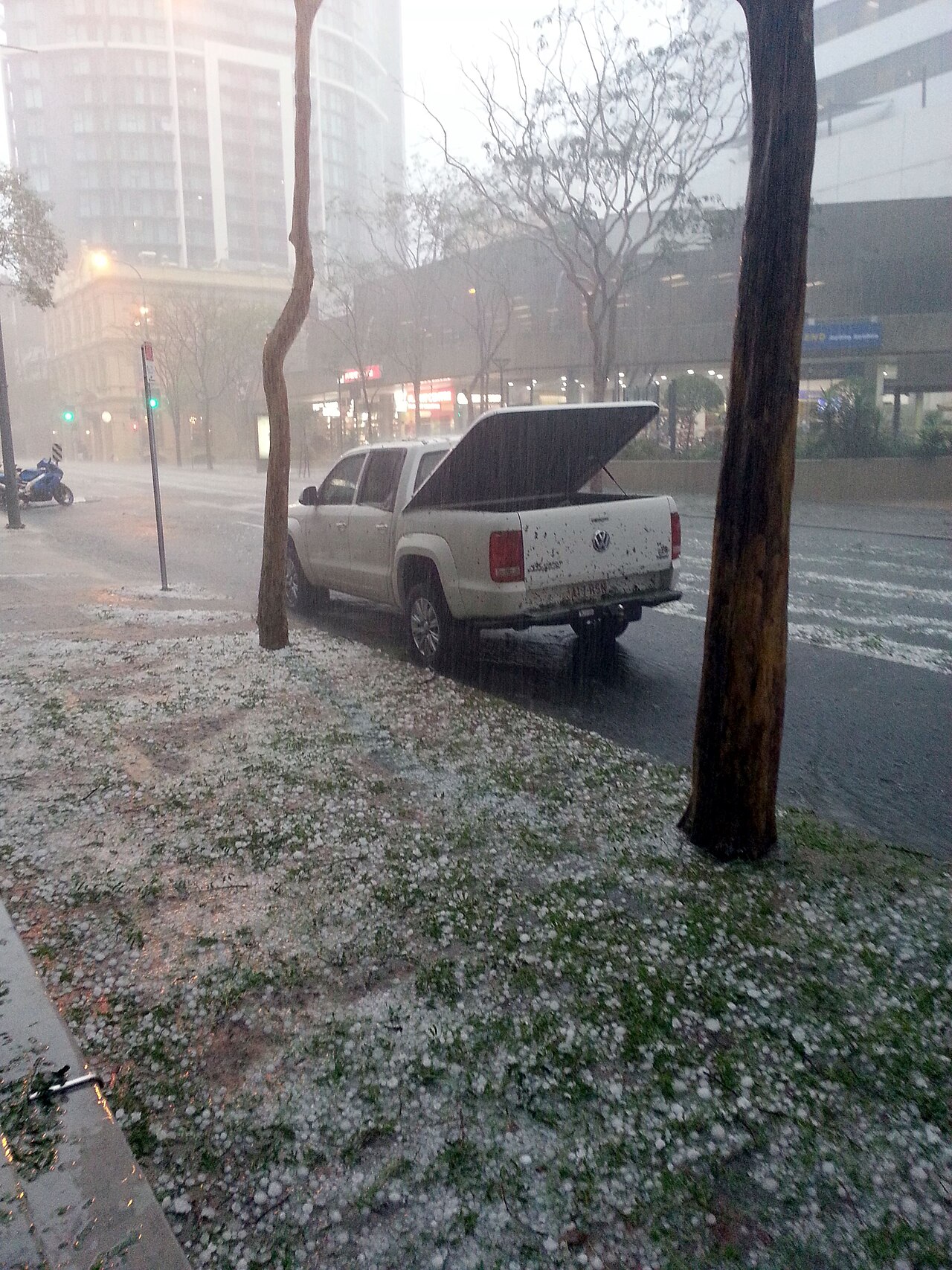 Hail covers a Brisbane street and grass, showing the widespread damage from the 2014 hailstorm. Hail covers a Brisbane street and grass, showing the widespread damage from the 2014 hailstorm.