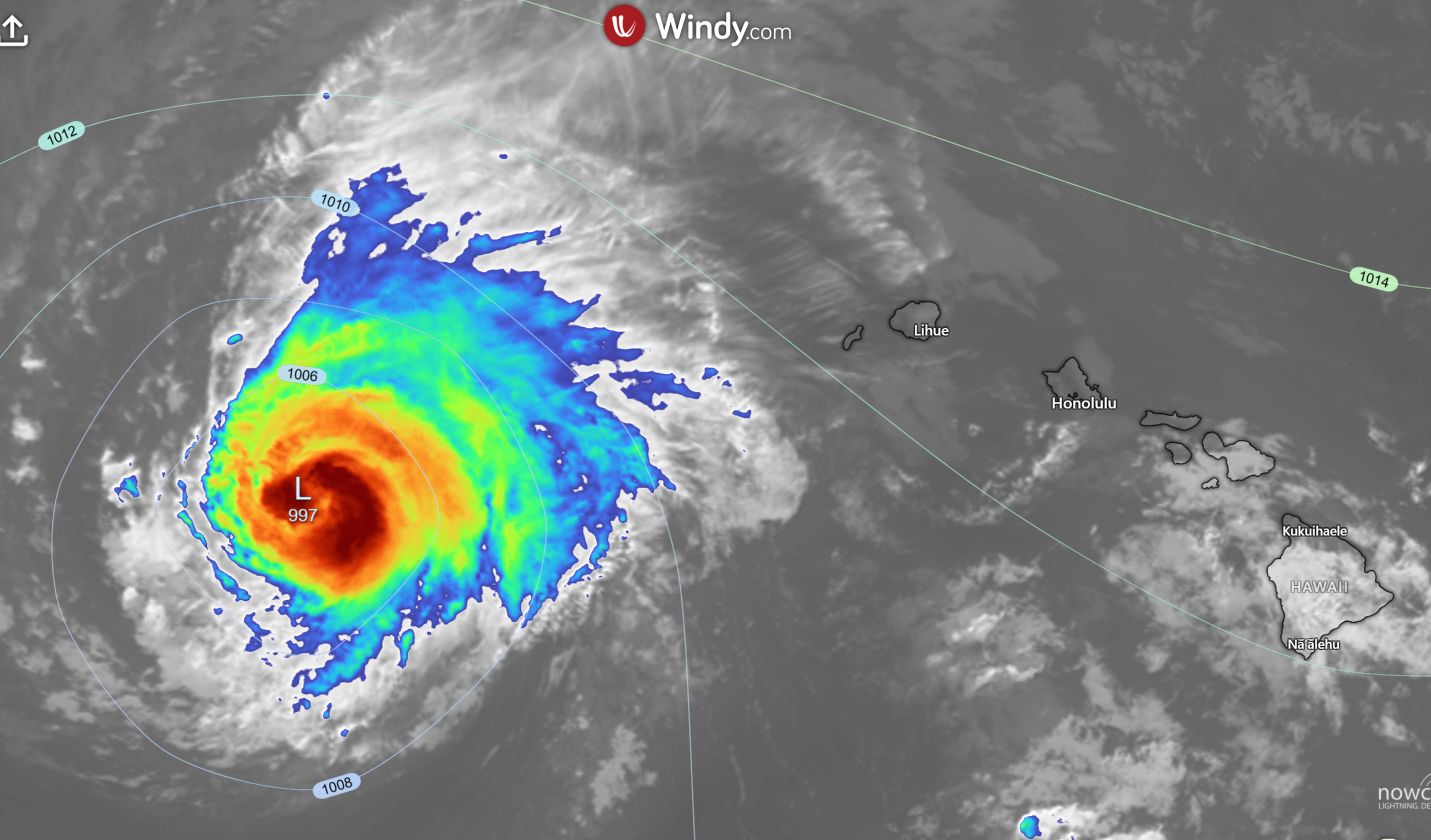 Satellite weather map showing a tropical cyclone with a low-pressure center (997 hPa) near Hawaii, illustrating tropical depr Satellite weather map showing a tropical cyclone with a low-pressure center (997 hPa) near Hawaii, illustrating tropical depr
